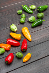 Brussels sprouts, green and red peppers on table.