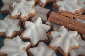 Christmas cookies in the shape of a star with white icing.