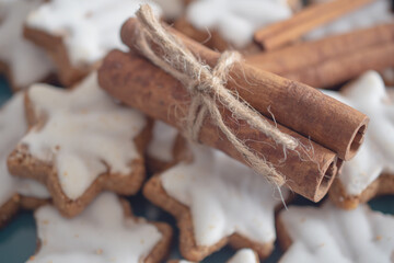 Christmas cookies in the shape of a star with white icing.