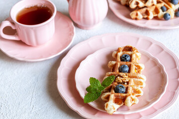 Сroffle, trendy crispy korean  baked goods, top view on white background, selective focus