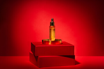 Gold cosmetics on a red podium with gift boxes and decor on red background