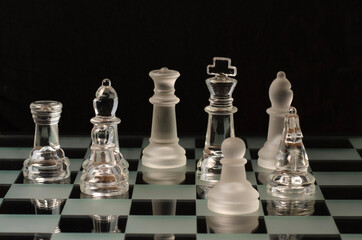 Glass chess on glass board	