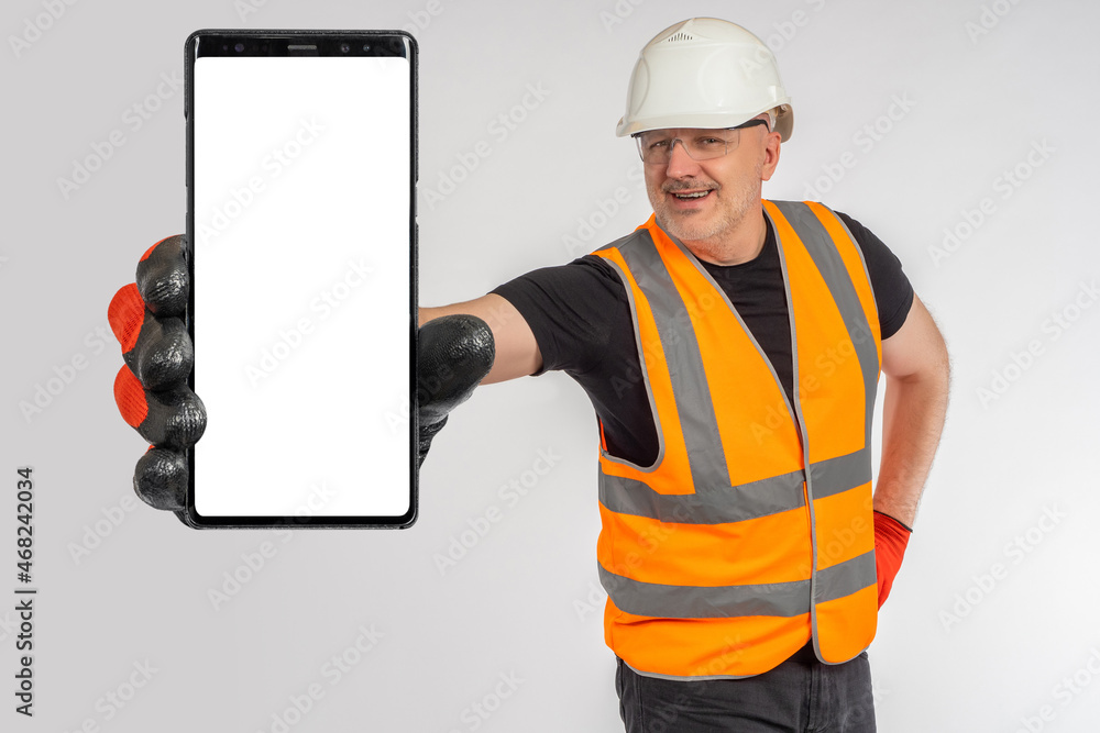 Poster phone hand close up. builder hand with phone. smartphone blank display. man builder on light backgro