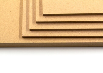 Several mdf boards, cut to certain dimensions, stand on a white background.