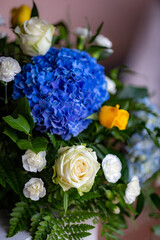 colourful bouquet with dominant blue and white flowers on wedding