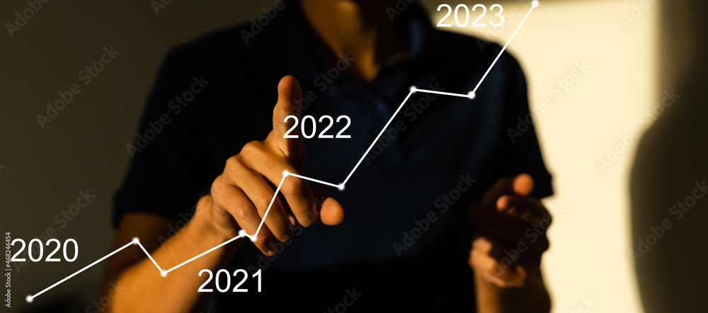 Poster businessman hand working with virtual chart business on touch screen computer as concept