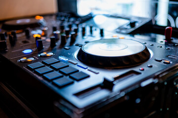 Dj mixing console in a night club or disco