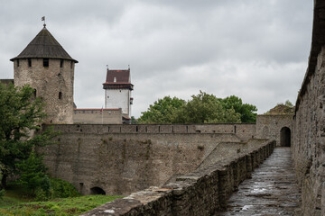 Fototapeta na wymiar View to Narva castle from walls of Ivangorod forteress. Invangorod, Russia