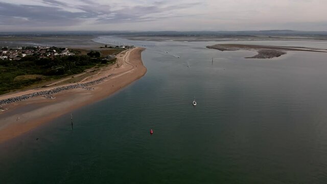Aerial view of small vessels yachts sail in front of Hayling Beach off the coast of Southsea on a sunny morning. Bracklesham Bay. 