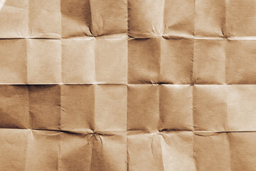 Texture of folded brown paper as background