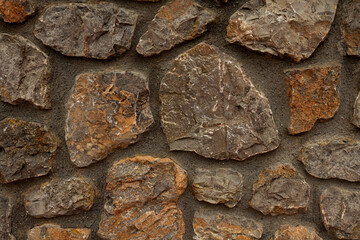 Background of orange stone wall texture horizontal photo