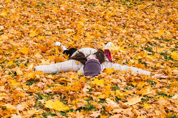 lying in leaves, young woman, kids, colorful, golden, leaf, orange, background, autumn, lifestyle, park, happiness, fall, happy, person, people, one, joy, leaves, beautiful, yellow, outdoors, nature, 