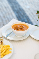 Shellfish soup served in bowl ready to eat