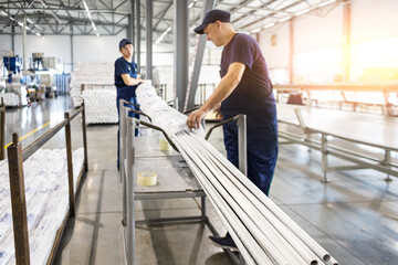 factory workers engineer checks the quality of polypropylene pipes