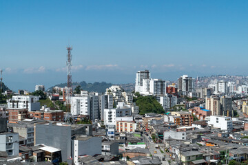 Fototapeta premium Panoramic and urban landscape of the city of Manizales and blue sky. Manizales, Caldas, Colombia.