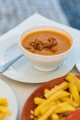 Shellfish soup served in bowl ready to eat