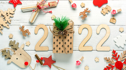 Christmas composition made of Christmas decoration and 2022 numbers on White background. Minimal concept of Xmas and New Year