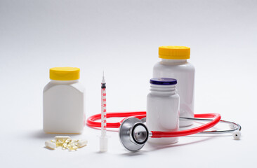 Medicines pills and medical devices on a light background.