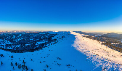 Naklejka na ściany i meble Magical winter panorama of beautiful snowy slopes