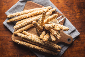 Breadsticks grissini. Bread sticks with sesame seeds.