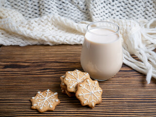 Traditional Christmas drink made of eggnog with cinnamon and ginger cookies. Cookies and milk