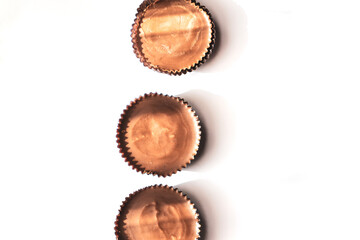 Peanut butter filled candy with chocolate frosting isolated on white background