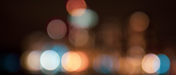 abstract defocused view of skyscrapers with large colorful circles