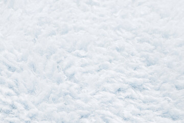 Texture of light blue artificial fur close up. Home decor and comfort concept.