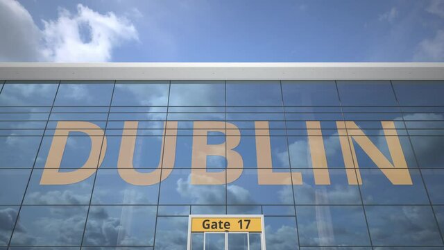 DUBLIN text revealed with landing airplane on airport building