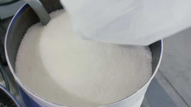 Barrel with polypropylene granules in the technological process. PP Pet Chips Semi Dull, PET chips recycle, PET polyester chips
