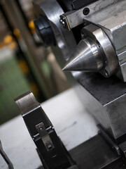 The tailstock of a lathe. Processing of parts. Manufacturing equipment