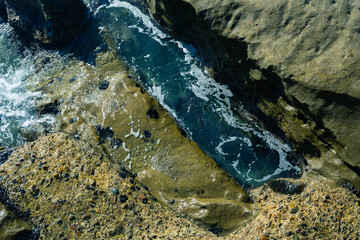 stone ground near the pacific ocean with water