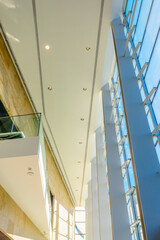 Obraz premium Painted in brown. Abstract fragment of the architecture of modern lobby, hallway of the luxury hotel, shopping mall, business center in Vancouver, Canada. Interior design.