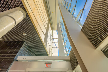 Obraz premium Abstract fragment of the architecture of modern lobby, hallway of the luxury hotel, shopping mall, business center in Vancouver, Canada. Interior design.