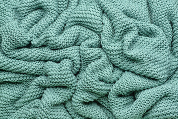 Texture of crumpled knitted fabric as background