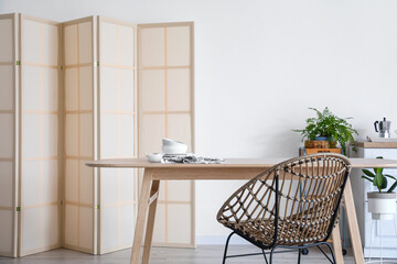 Wooden dining table in kitchen interior