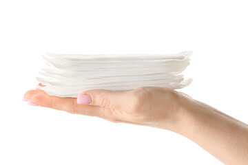 Female hand with menstrual pads on white background