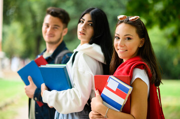 Happy students outdoor smiling together