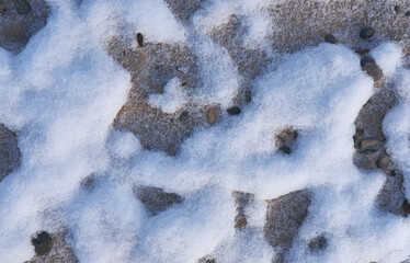 Snow patterns in the sand.