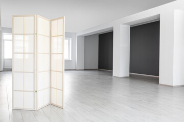 View of big empty office with folding screen