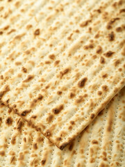 Macro photography. Traditional Jewish bread - matzah. Concept - Jewish Easter, religion, Judaism, holiday, traditions. rituals, sacred food, treats. Minimalism.