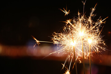 Beautiful sparklers at night outdoors