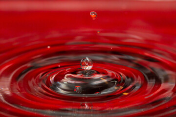 Red water reflection and water orbs frozen in time - stock photo.jpg
