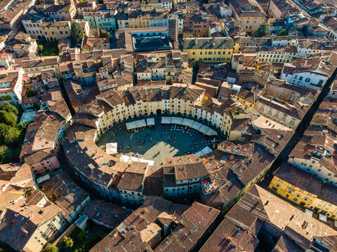 Aerial view of Piazza dell'Anfiteatro, a medieval square with caf&egrave; and market in Lucca old town, Tuscany, Italy.