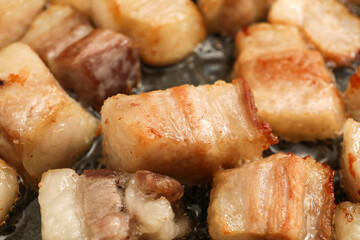 Many tasty cracklings as background, closeup