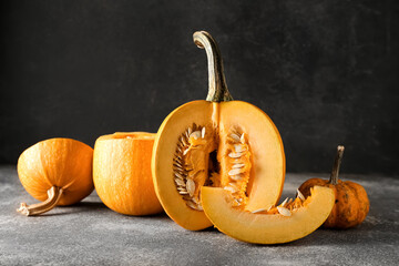 Ripe cut pumpkin on dark background