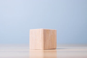wooden geometric shapes cube on table