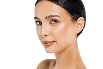 Fototapeta premium Toothy smiling young woman, with shiny radiant perfect face skin and bare shoulders, looks towards beauty studio