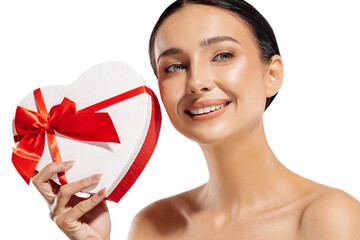 Happy beautiful young woman holding red gift box on isolated white background