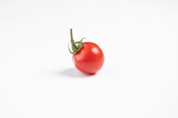 Pomodorino rosso su sfondo bianco / Red cherry tomato on a white background 